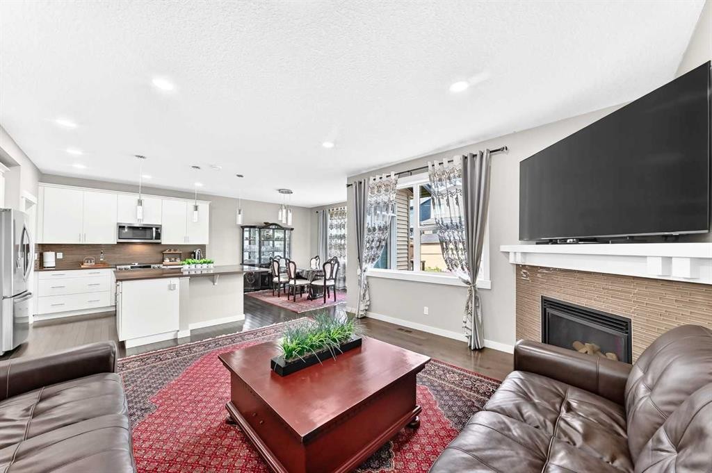 56 Evansborough Green Nw, Calgary, AB - Indoor Photo Showing Living Room With Fireplace