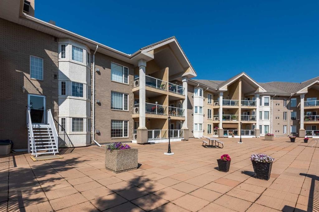 304-728 Country Hills Road Nw, Calgary, AB - Outdoor With Balcony With Facade