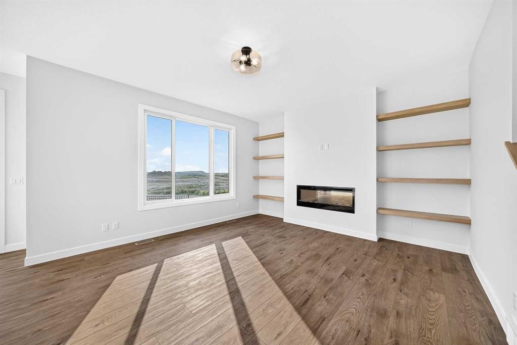199 Langwell Common Se, Airdrie, AB - Indoor With Fireplace