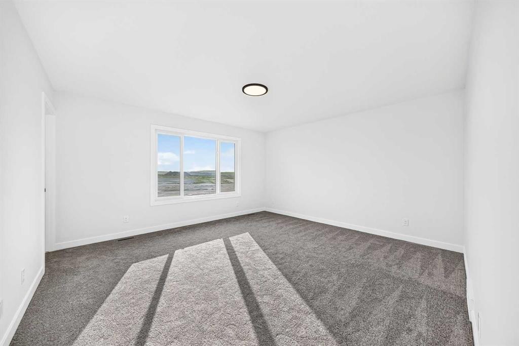 199 Langwell Common Se, Airdrie, AB - Indoor Photo Showing Other Room