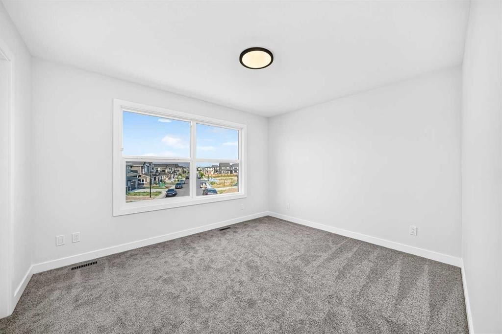 199 Langwell Common Se, Airdrie, AB - Indoor Photo Showing Other Room