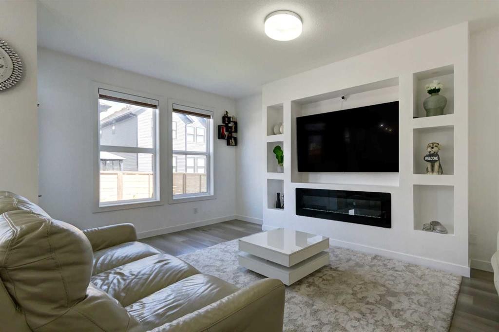 92 Copperhead Grove Se, Calgary, AB - Indoor Photo Showing Living Room With Fireplace