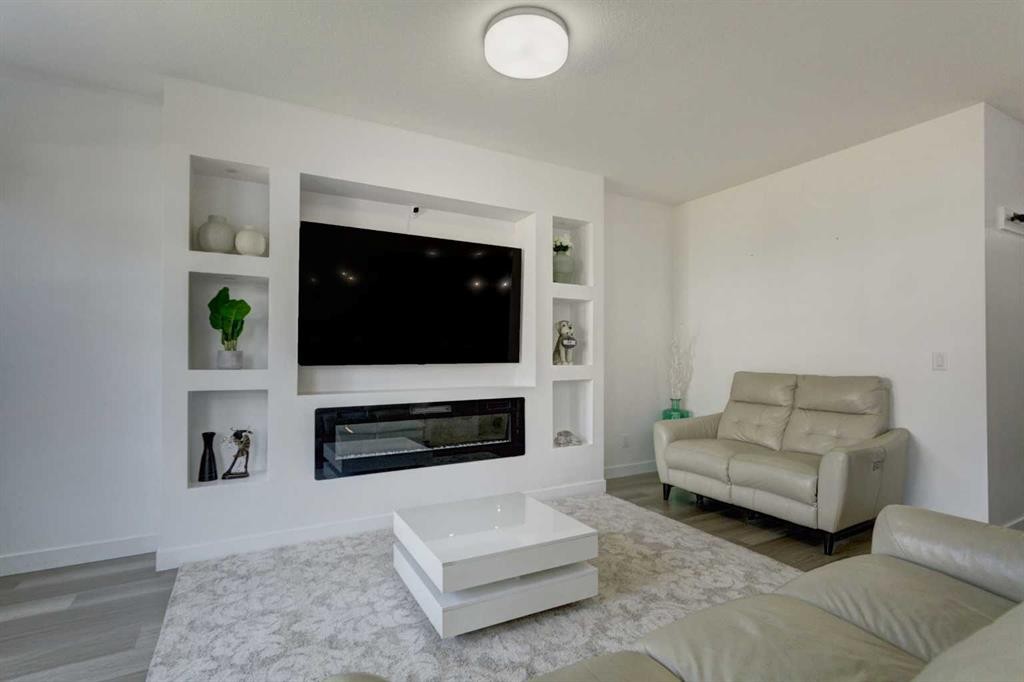 92 Copperhead Grove Se, Calgary, AB - Indoor Photo Showing Living Room With Fireplace