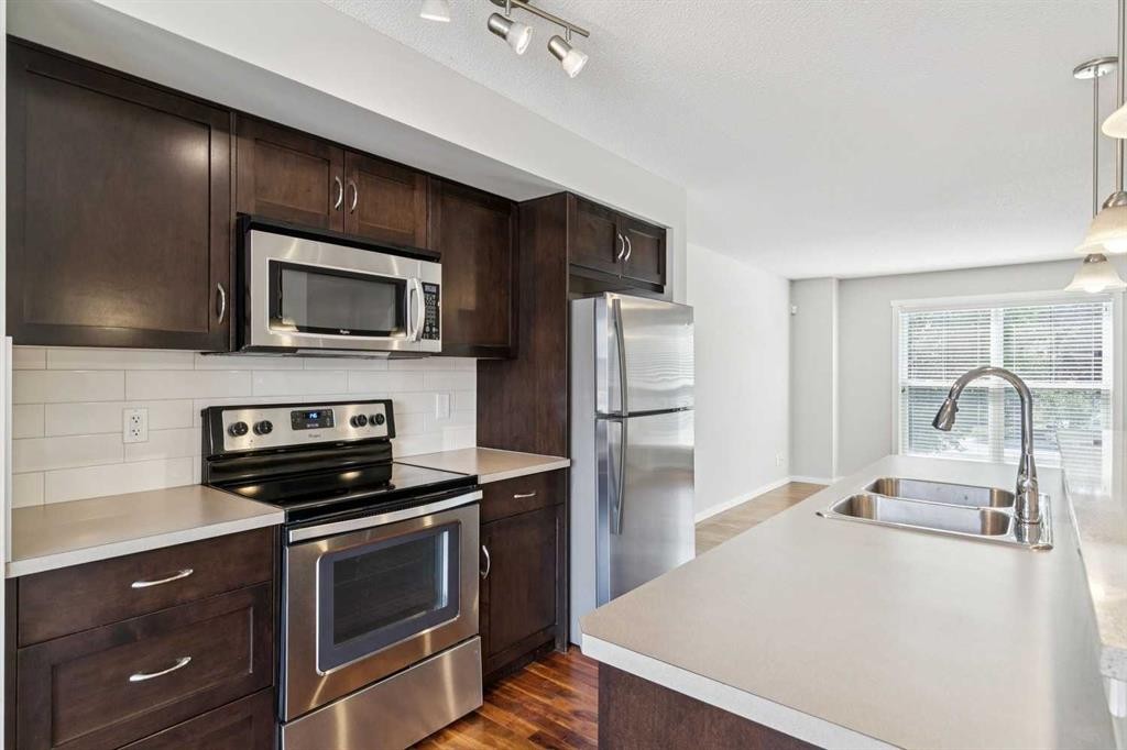 28 Walden Drive Se, Calgary, AB - Indoor Photo Showing Kitchen With Double Sink With Upgraded Kitchen