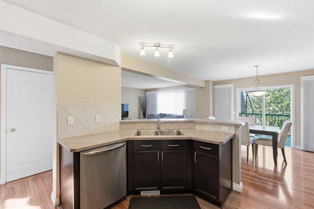 140 Arbour Stone Crescent Nw, Calgary, AB - Indoor Photo Showing Kitchen With Double Sink