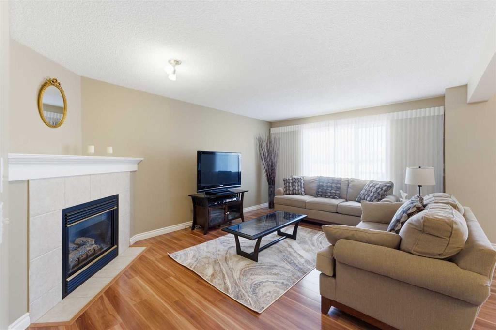140 Arbour Stone Crescent Nw, Calgary, AB - Indoor Photo Showing Living Room With Fireplace