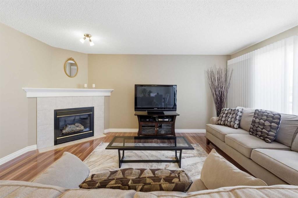 140 Arbour Stone Crescent Nw, Calgary, AB - Indoor Photo Showing Living Room With Fireplace