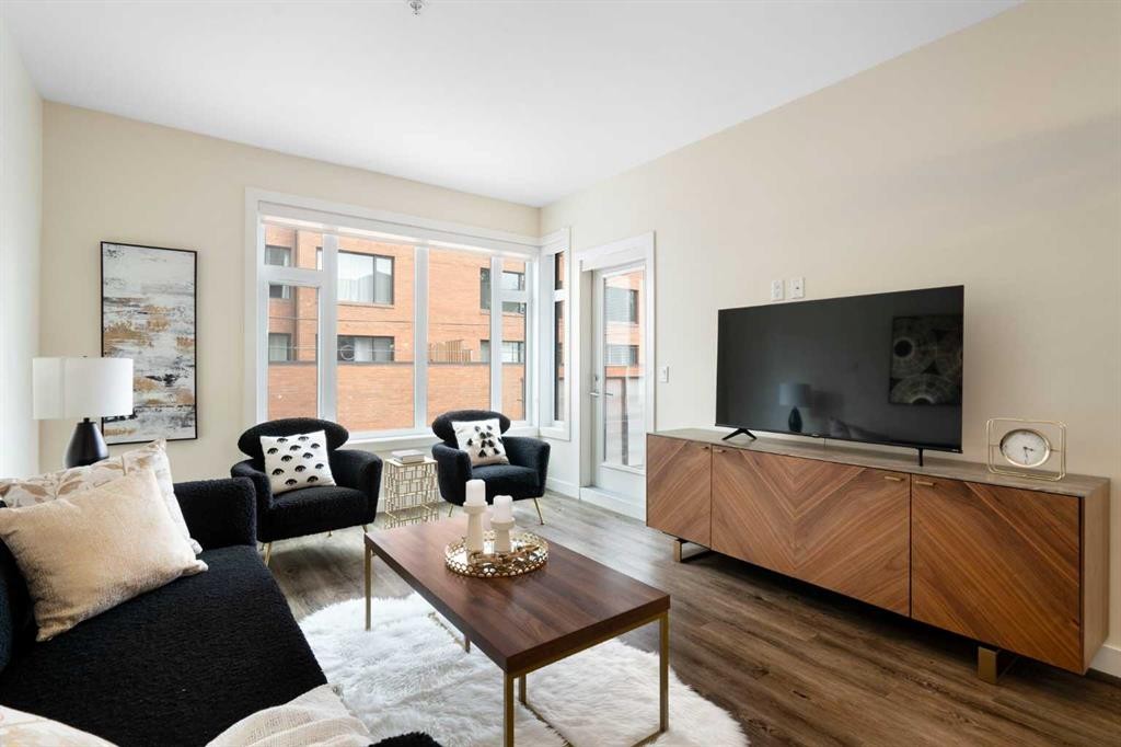 209-1720 10 Street Sw, Calgary, AB - Indoor Photo Showing Living Room