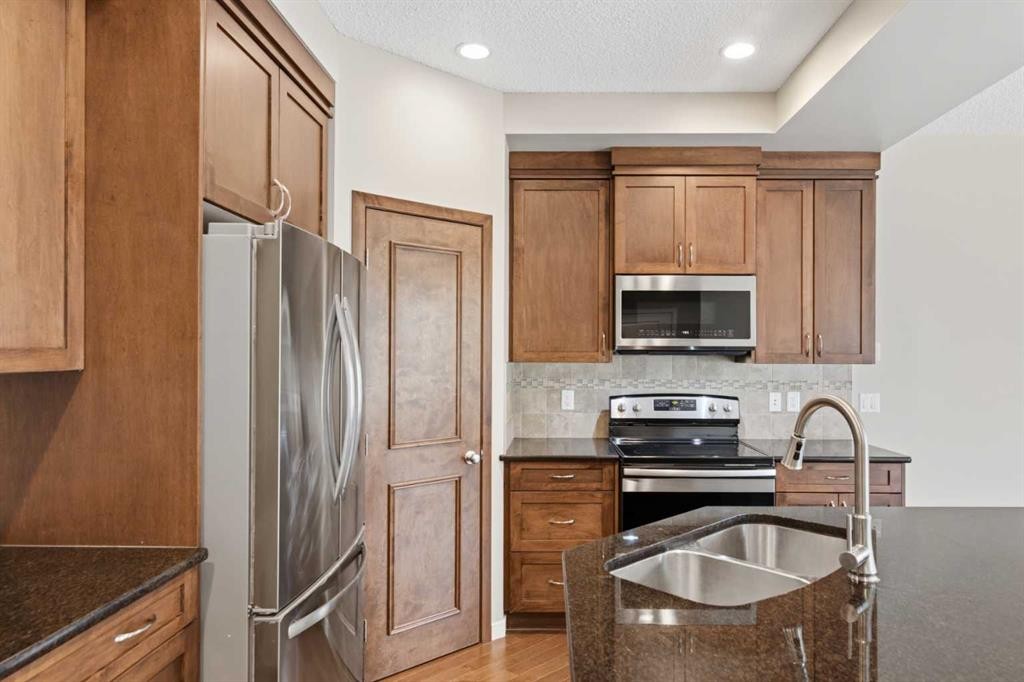 40 Panatella Mews Nw, Calgary, AB - Indoor Photo Showing Kitchen With Stainless Steel Kitchen With Double Sink