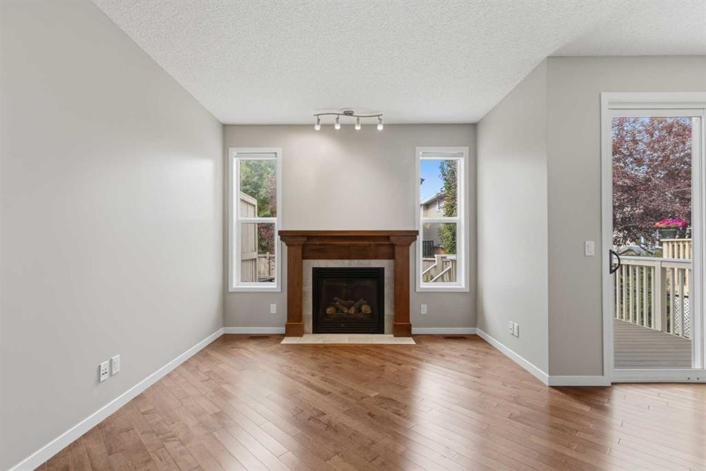 40 Panatella Mews Nw, Calgary, AB - Indoor Photo Showing Living Room With Fireplace