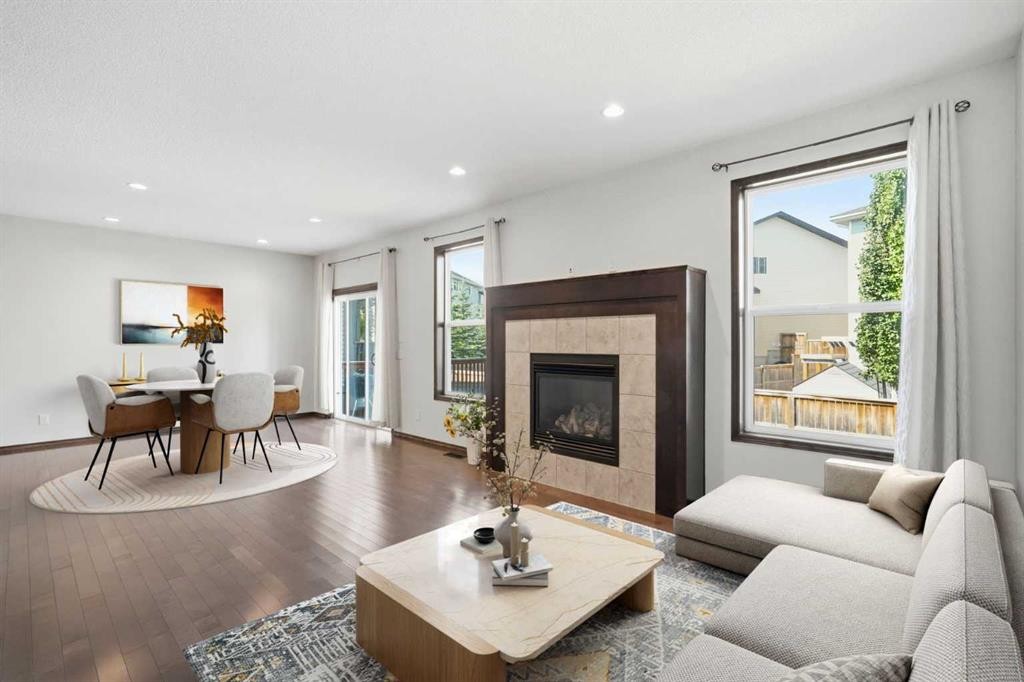 691 Panamount Boulevard Nw, Calgary, AB - Indoor Photo Showing Living Room With Fireplace