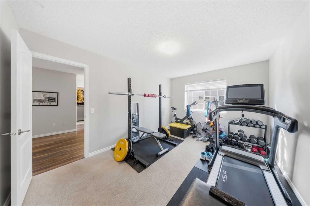 501 Patterson View Sw, Calgary, AB - Indoor Photo Showing Gym Room