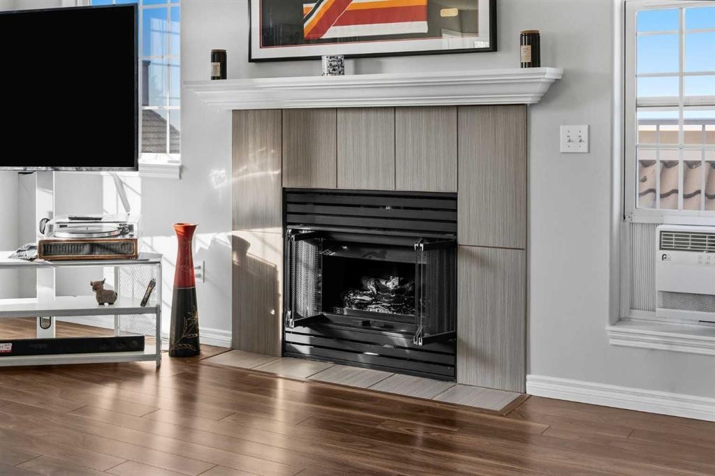 501 Patterson View Sw, Calgary, AB - Indoor Photo Showing Living Room With Fireplace