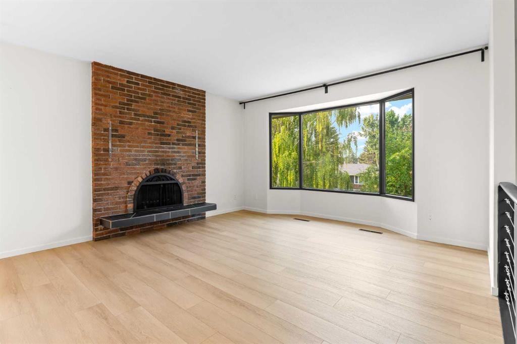 5467 Dalrymple Crescent Nw, Calgary, AB - Indoor Photo Showing Living Room With Fireplace