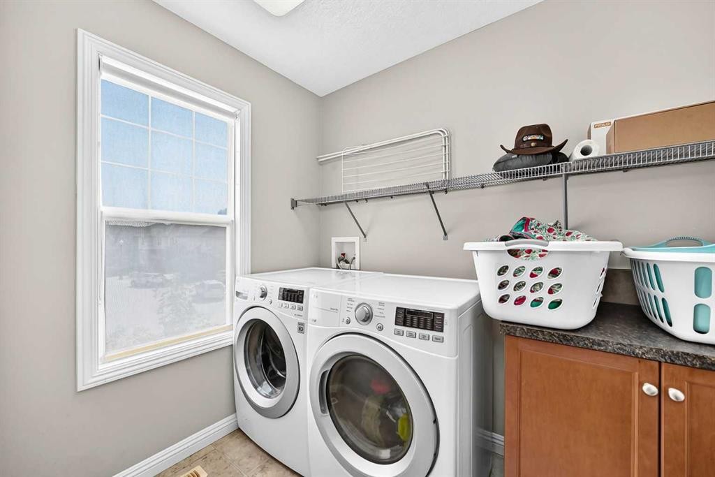 153 Cranleigh Bay Se, Calgary, AB - Indoor Photo Showing Laundry Room