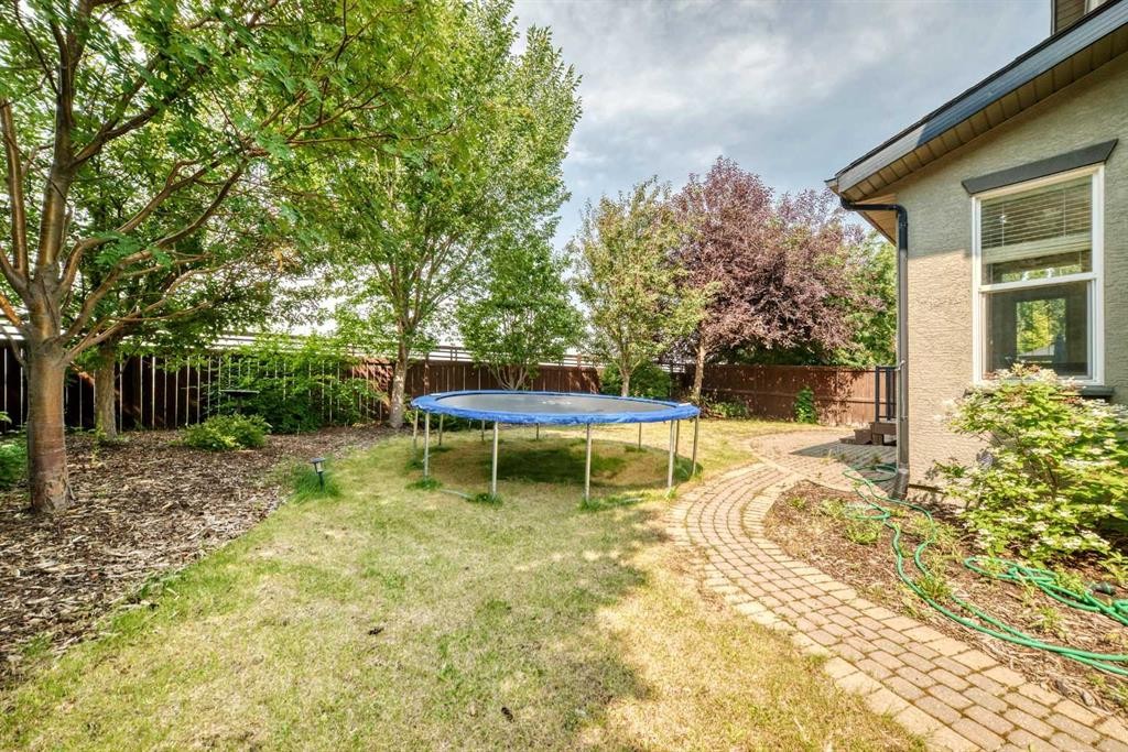 153 Cranleigh Bay Se, Calgary, AB - Outdoor With Backyard