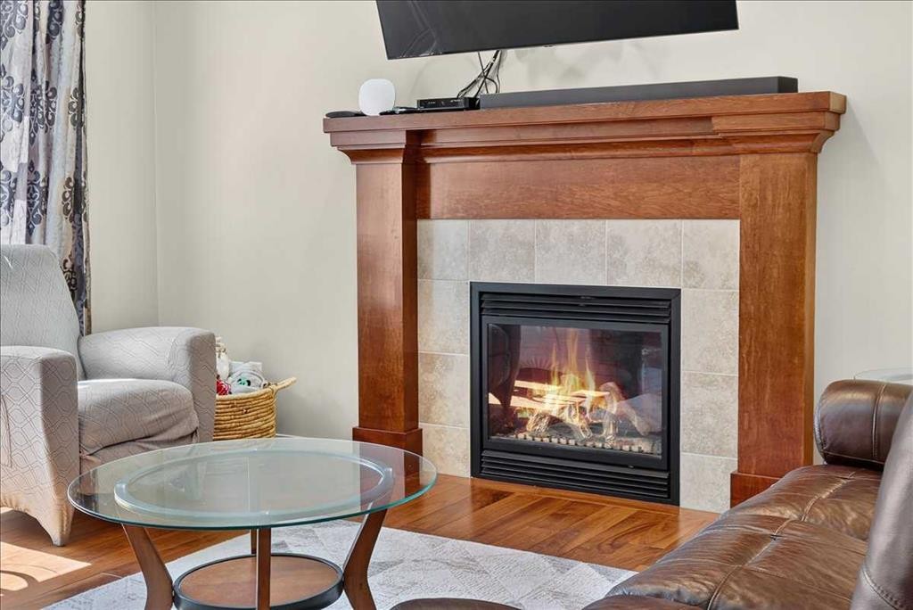 1017 Brightoncrest Common Se, Calgary, AB - Indoor Photo Showing Living Room With Fireplace
