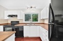321 Elgin Point Se, Calgary, AB  - Indoor Photo Showing Kitchen With Double Sink 