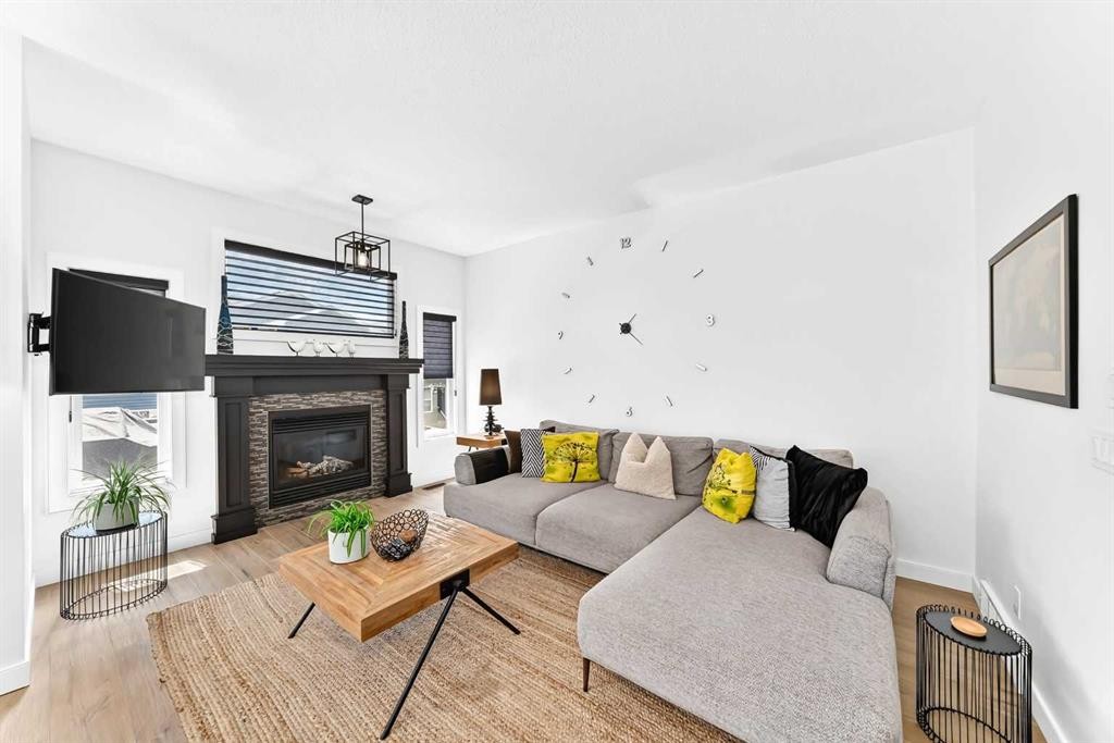 132 Evanscove Manor Nw, Calgary, AB - Indoor Photo Showing Living Room With Fireplace