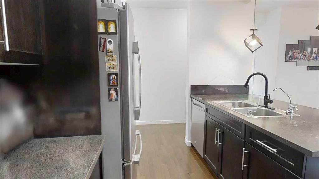 222 Copperpond Boulevard Se, Calgary, AB - Indoor Photo Showing Kitchen With Double Sink