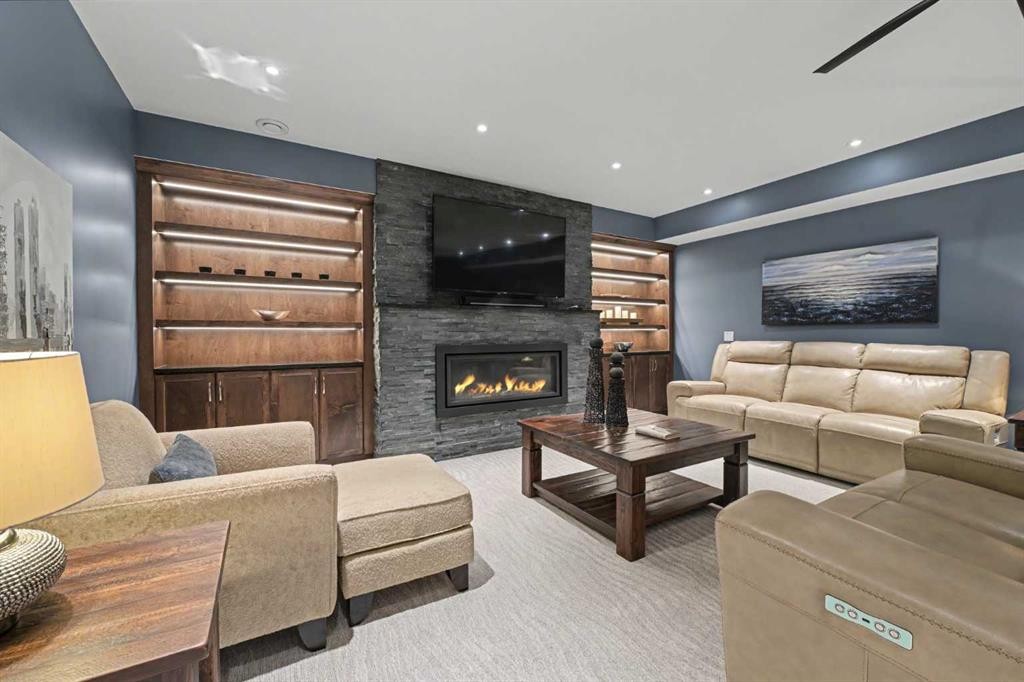 59 Evanswood Circle Nw, Calgary, AB - Indoor Photo Showing Living Room With Fireplace