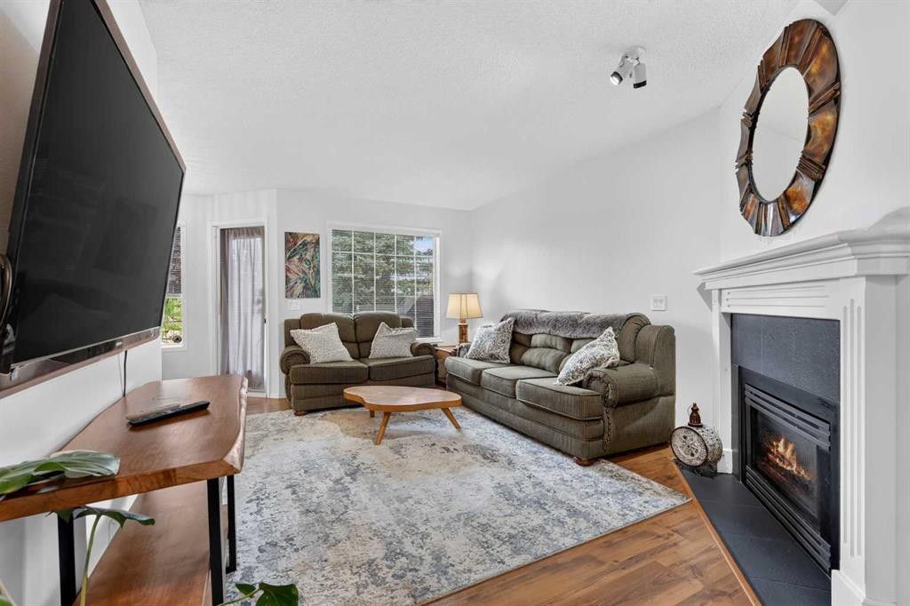 37 Beddington Gardens Ne, Calgary, AB - Indoor Photo Showing Living Room With Fireplace
