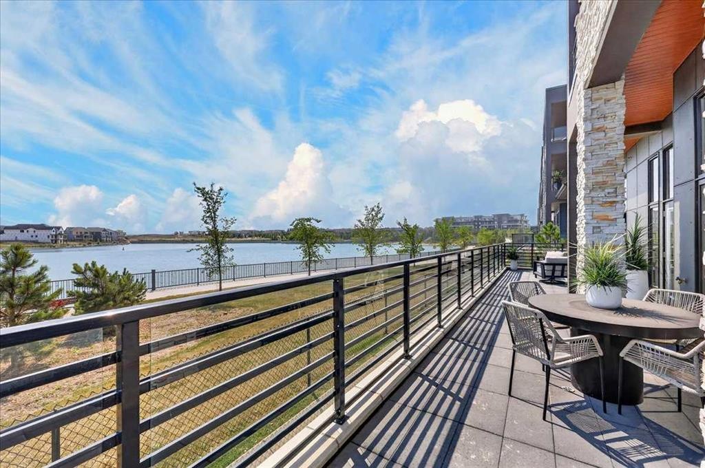 102-150 Marina Cove Se, Calgary, AB - Outdoor With Body Of Water With View