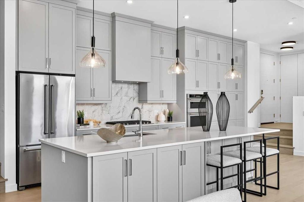 102-150 Marina Cove Se, Calgary, AB - Indoor Photo Showing Kitchen With Stainless Steel Kitchen With Upgraded Kitchen