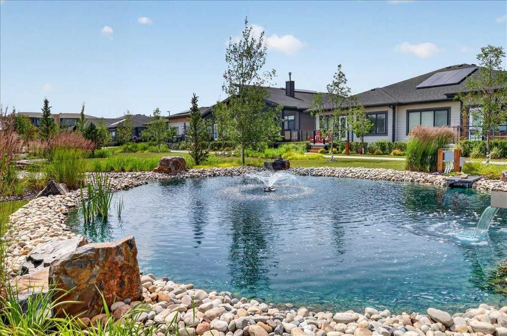 102-150 Marina Cove Se, Calgary, AB - Outdoor With Body Of Water