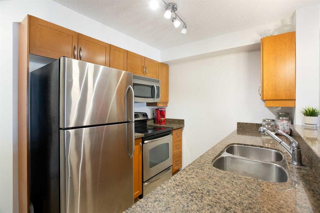 4310-60 Panatella Street Nw, Calgary, AB - Indoor Photo Showing Kitchen With Stainless Steel Kitchen With Double Sink