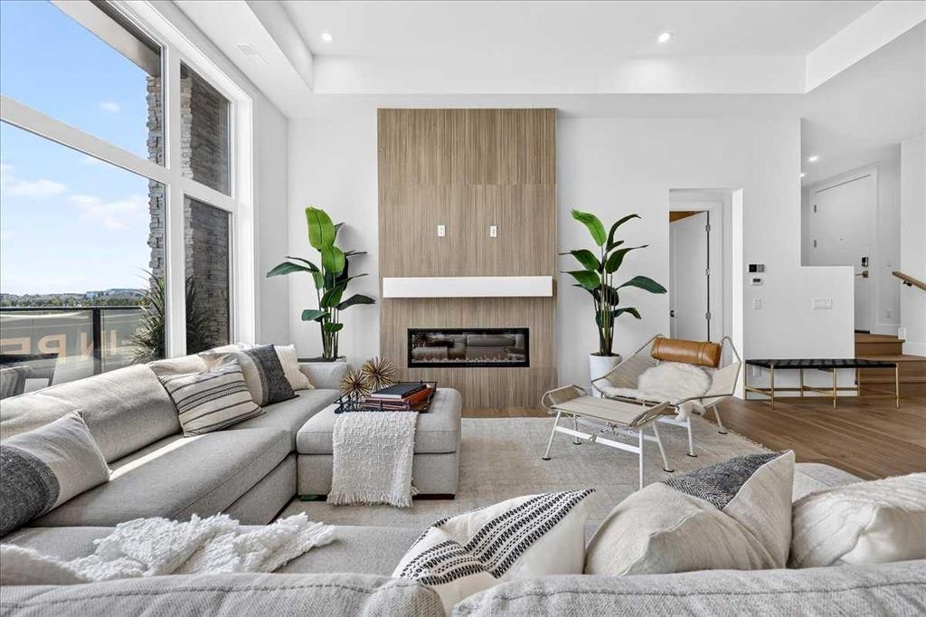 101-150 Marina Cove Se, Calgary, AB - Indoor Photo Showing Living Room With Fireplace