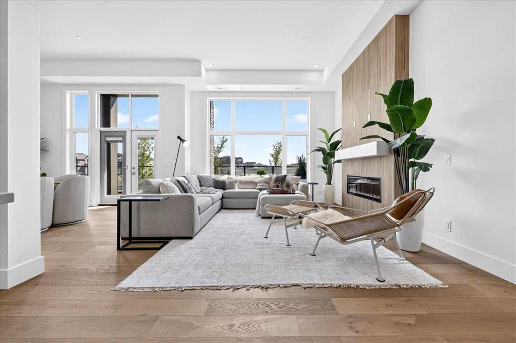 101-150 Marina Cove Se, Calgary, AB - Indoor Photo Showing Living Room With Fireplace