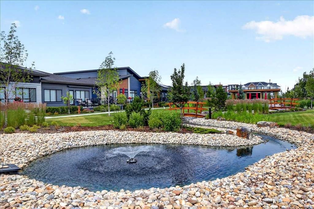 101-150 Marina Cove Se, Calgary, AB - Outdoor With Body Of Water