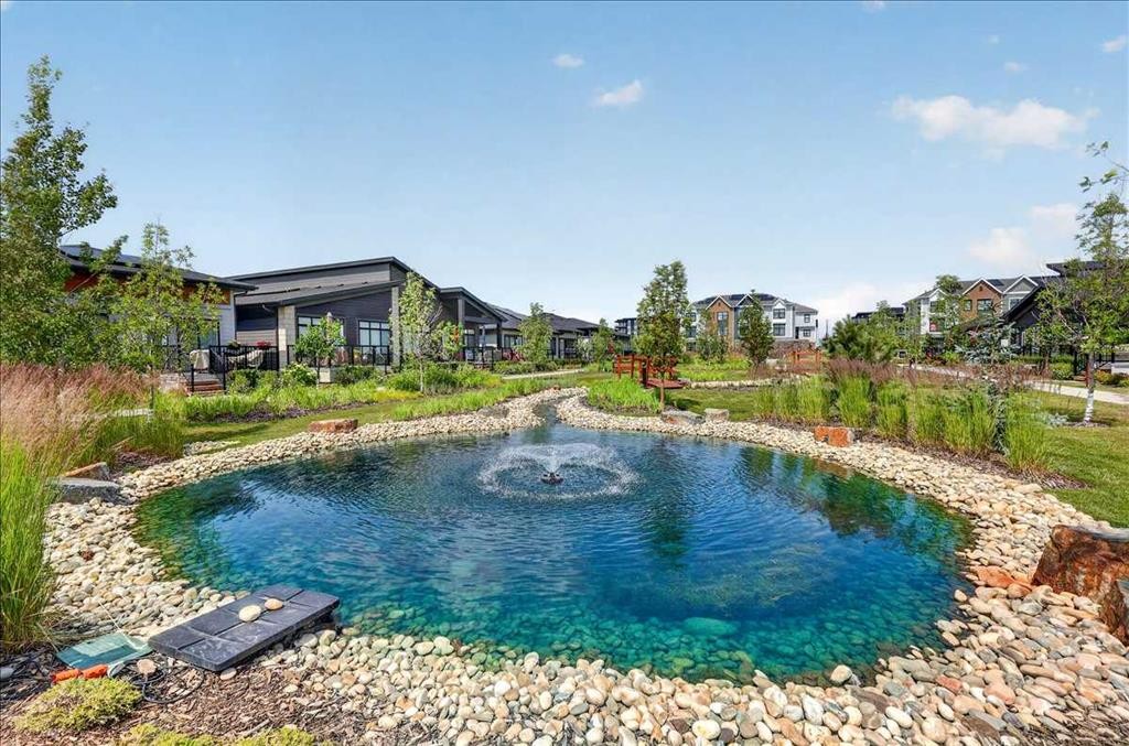 101-150 Marina Cove Se, Calgary, AB - Outdoor With Body Of Water