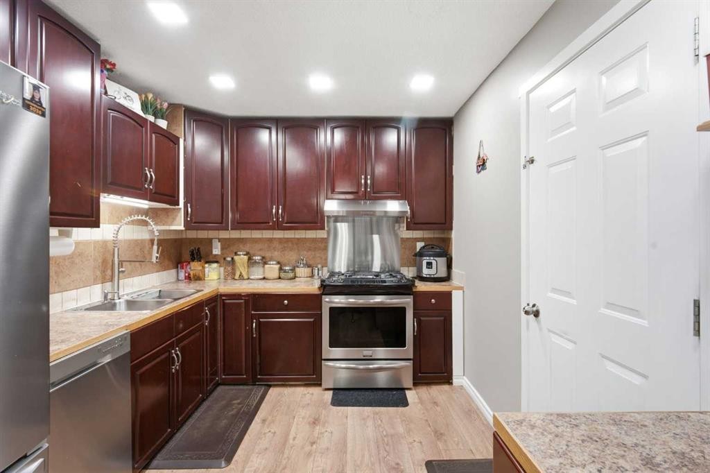 227 Abalone Place Ne, Calgary, AB - Indoor Photo Showing Kitchen With Stainless Steel Kitchen With Double Sink