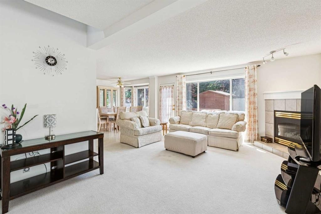 10521 Hidden Valley Drive Nw, Calgary, AB - Indoor Photo Showing Living Room With Fireplace