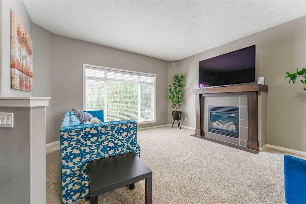 57 Sage Bank Grove Nw, Calgary, AB - Indoor Photo Showing Living Room With Fireplace