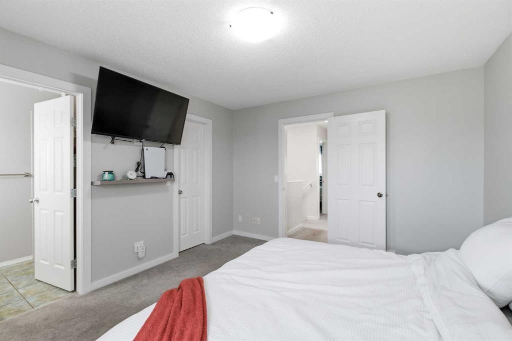 9 Ross Place, Crossfield, AB - Indoor Photo Showing Bedroom