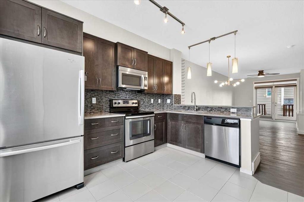 77 Kinlea Way Nw, Calgary, AB - Indoor Photo Showing Kitchen With Stainless Steel Kitchen With Upgraded Kitchen