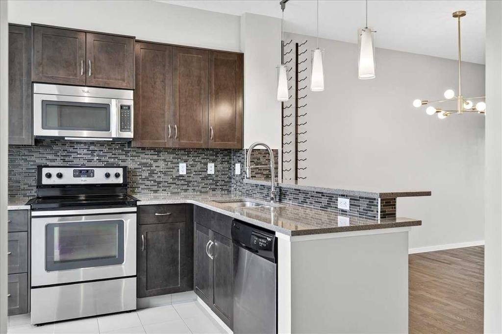 77 Kinlea Way Nw, Calgary, AB - Indoor Photo Showing Kitchen With Stainless Steel Kitchen With Upgraded Kitchen