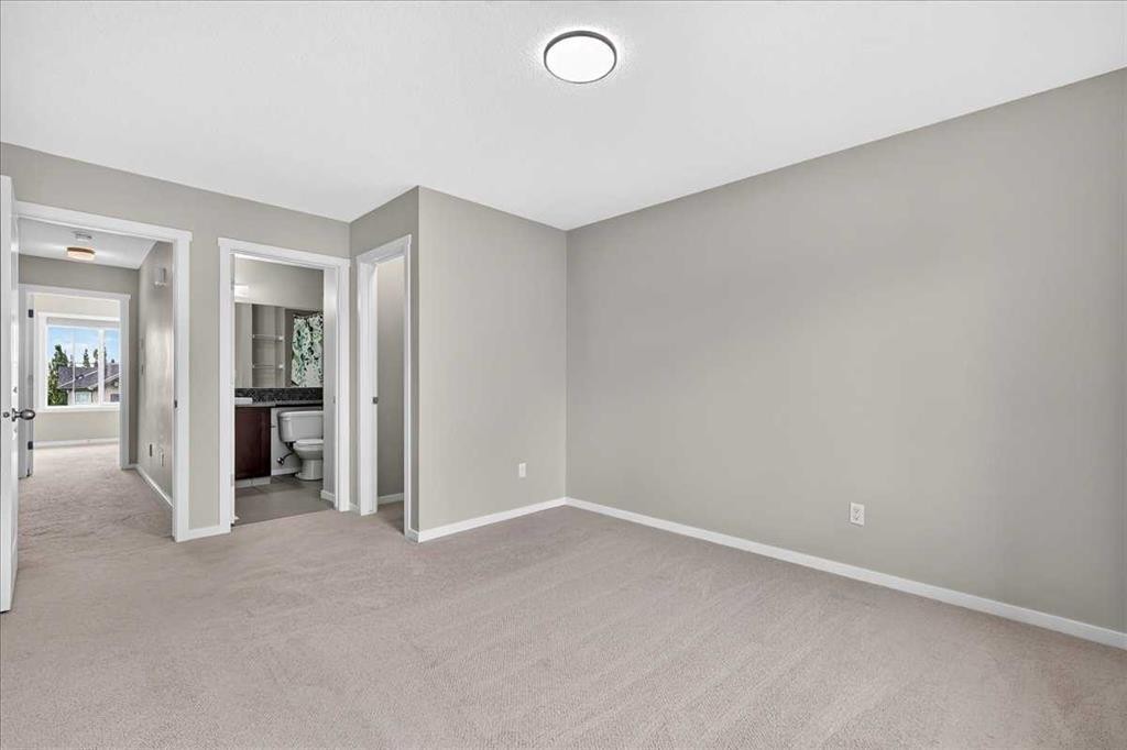 77 Kinlea Way Nw, Calgary, AB - Indoor Photo Showing Other Room