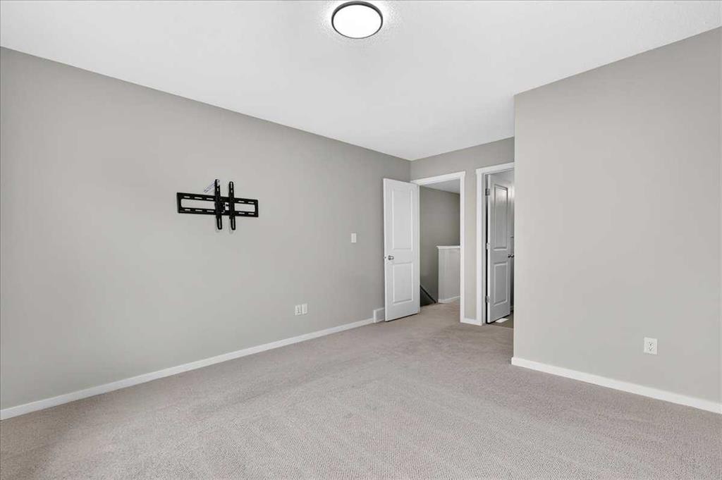 77 Kinlea Way Nw, Calgary, AB - Indoor Photo Showing Other Room