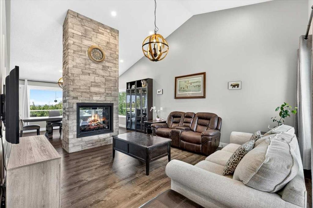 76-16044 258 Avenue East, Rural Foothills County, AB - Indoor Photo Showing Living Room With Fireplace
