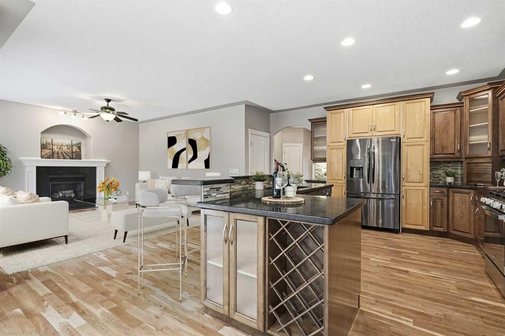 75 Royal Abbey Rise Nw, Calgary, AB - Indoor Photo Showing Kitchen With Fireplace