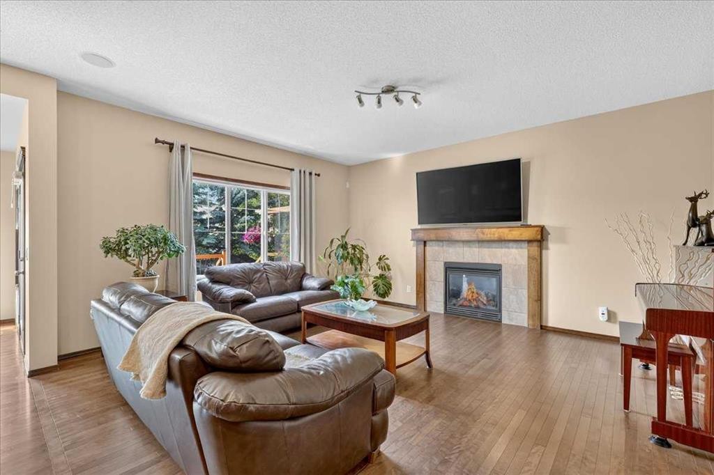 277 Evermeadow Avenue Sw, Calgary, AB - Indoor Photo Showing Living Room With Fireplace