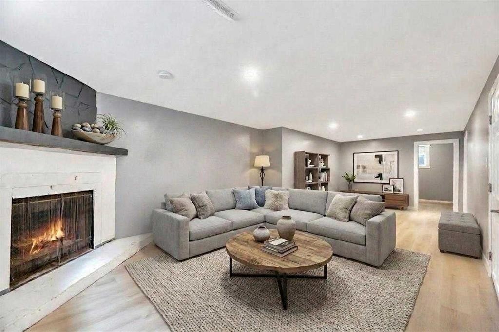 4819 Memorial Drive Se, Calgary, AB - Indoor Photo Showing Living Room With Fireplace