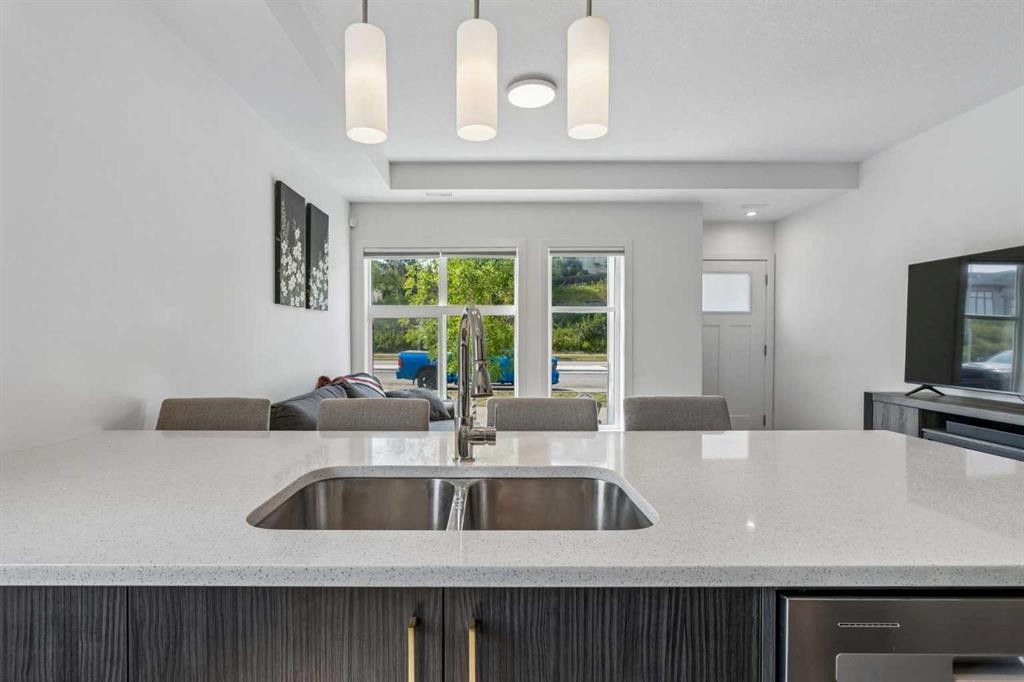 103 Spring Creek Common Sw, Calgary, AB - Indoor Photo Showing Kitchen With Double Sink