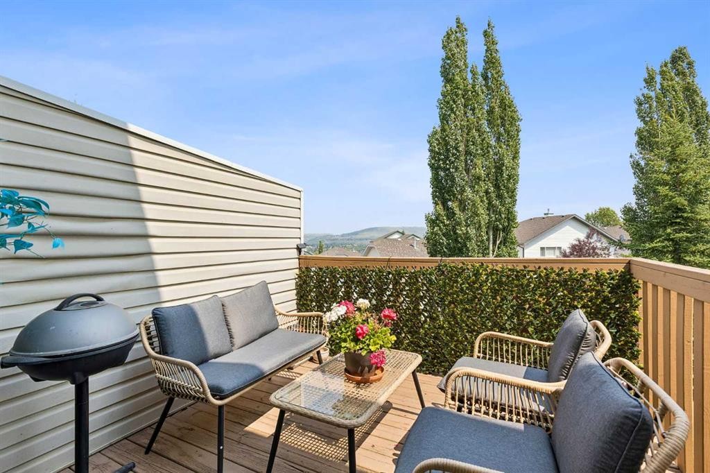 10-117 Bow Ridge Drive, Cochrane, AB - Outdoor With Deck Patio Veranda With Exterior