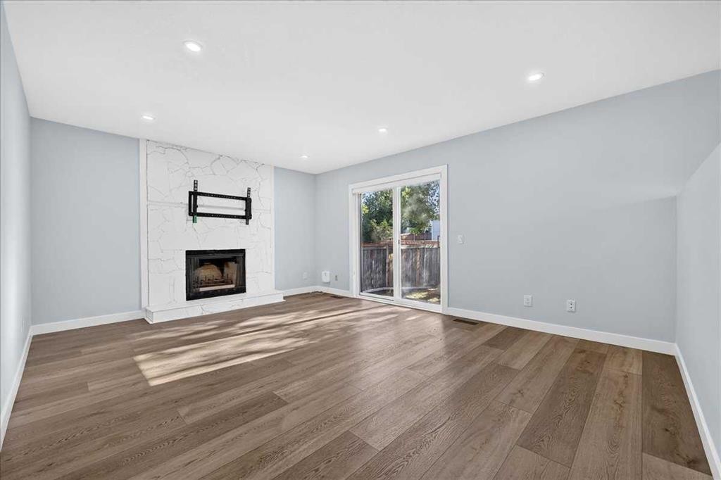 55 Whitehaven Crescent Ne, Calgary, AB - Indoor Photo Showing Living Room With Fireplace