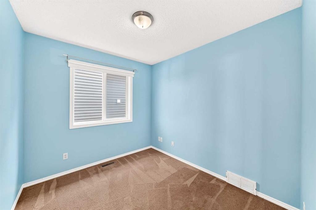 76 Coville Close Ne, Calgary, AB - Indoor Photo Showing Other Room